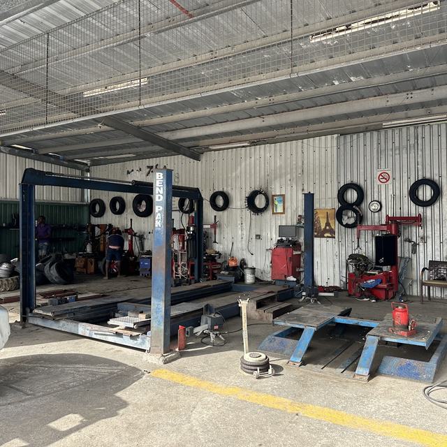 Workshop with tyre machines and alignment bay